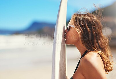 Buy stock photo Surf, woman and kiss on surfboard for vacation, hobby and love for adventure on beach. Female person, sunglasses and travel in summer for holiday, water sport and outdoor in nature in Australia