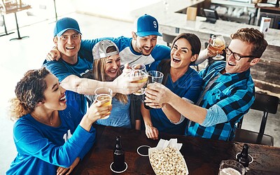 Buy stock photo Sports, celebration and group in pub with beer for support of team and winning or success from above. Friends, people or fans at restaurant with drinks, wine or alcohol in toast or cheers of football
