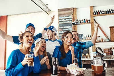 Buy stock photo Friends, support and watching tv at sport pub with game, goal and beer at restaurant with celebration. Fan group, smile and happy with esports, excited and match together or people at bar or team win