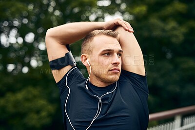 Buy stock photo Outdoor, stretching and man with fitness, training and energy for warm up, challenge or wellness. Person in park, podcast or runner with exercise, listening to music or workout with radio or flexible