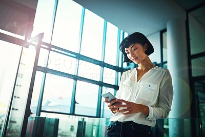 Buy stock photo Japanese woman, phone and reading in office for texting, click and contact with email notification. Person, employee and smartphone with mobile app for networking, scroll and chat at creative agency