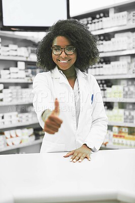 Buy stock photo Pharmacist, thumbs up and portrait of black woman with smile, yes or approval for healthcare in pharmacy. Female chemist, hand gesture or happy by counter for medicine, medicare or success in Nigeria