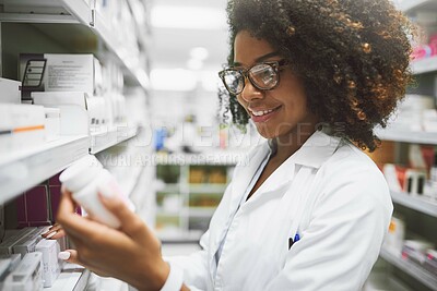 Buy stock photo Medicine, check and happy woman at a pharmacy for inventory, stock and prescription drug search. Industry, label or African pharmacist with glasses at store for pills, inspection or quality assurance