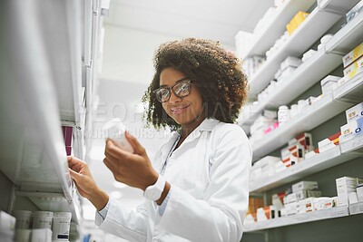 Buy stock photo Woman, wellness and medicine with pharmacy check, reading label for healthcare service or career. Female pharmacist, workplace and package inspection for inventory, prescription stock in drug store