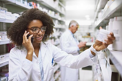 Buy stock photo Phone call, pharmacist and woman reading medicine information for stock or inventory. Smartphone, talking and happy pharmacy worker check medical drugs, label or pills for telehealth prescription