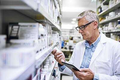 Buy stock photo Man, wellness and medicine with pharmacy check, reading label for healthcare service or career. Male pharmacist, workplace and package inspection for inventory, prescription stock in drug store