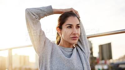 Buy stock photo Fitness, woman and stretching arm in city for healthy body, wellness and prepare for workout at sunset. Warm up, practice and female runner outdoor for training, exercise or ready for sports marathon