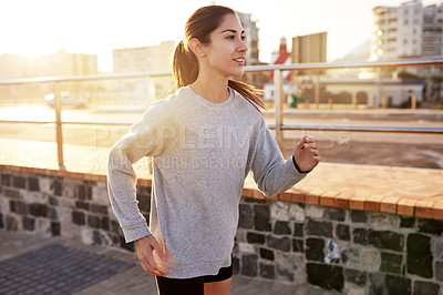 Buy stock photo Fitness, cardio and woman running in city for healthy body, wellness or exercise to lose weight at sunset. Jog, outdoor and athlete training, sports or endurance workout with energy for marathon race