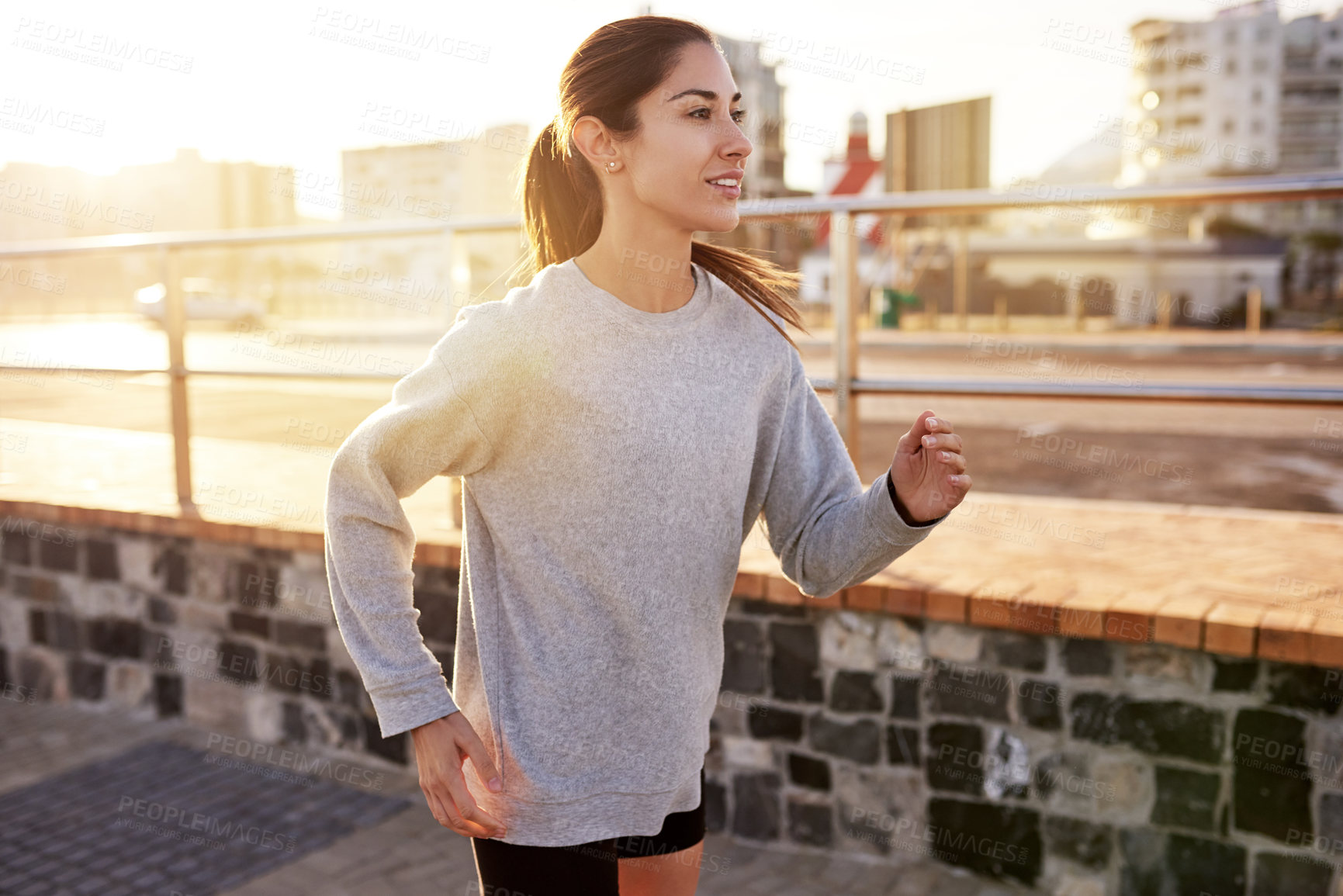 Buy stock photo Fitness, cardio and woman running in city for healthy body, wellness or exercise to lose weight at sunset. Jog, outdoor and athlete training, sports or endurance workout with energy for marathon race