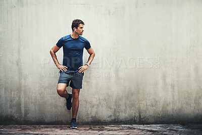 Buy stock photo Space, runner or man by wall background for fitness training, outdoor workout or sports exercise. Earphones, mockup and healthy athlete with confidence or music for running, podcast or performance