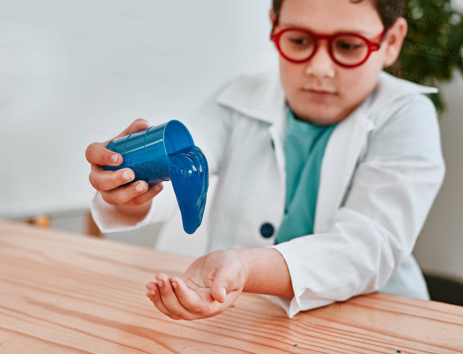 Buy stock photo Boy, learning and slime at school for science, thinking and playful with container in classroom. Child, blue liquid and education for chemical with ideas for studying, growth and progress at academy