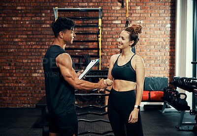 Buy stock photo Fitness training, woman and man with handshake, clipboard or contract for gym membership. People, instructor or workout with gesture, agreement or customer with documents, exercise or healthy routine