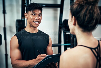 Buy stock photo Clipboard, membership or sign up with man and woman in gym together for exercise or fitness. Documents, contract and welcome with personal trainer speaking to client for information or introduction