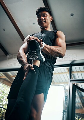 Buy stock photo Personal trainer, leg and help with stretching for fitness, body health or wellness in low angle. Happy man, coach or warm up in gym for hamstring flexibility, support or workout for training at club