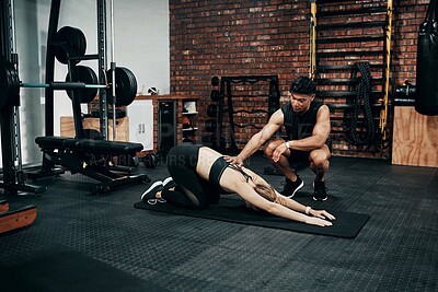 Buy stock photo Stretching, mat and woman in gym, personal trainer and help for exercise, fitness and advice for health. Club, talking and wellness with workout, friends and performance of training and warm up