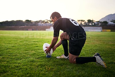 Buy stock photo Rugby, man and player with ball, outdoor and performance for practice, game and fitness for athlete. Playground, grass and professional with strength, match and training for football and person