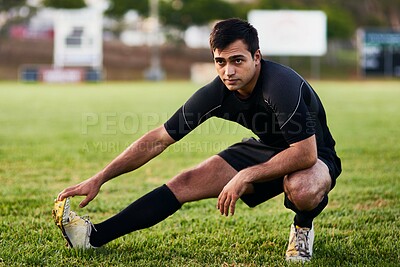 Buy stock photo Sport, rugby and man stretching for fitness on grass field with match warm up, game workout and performance. Athlete, player and leg exercise for competition preparation and practice for tournament