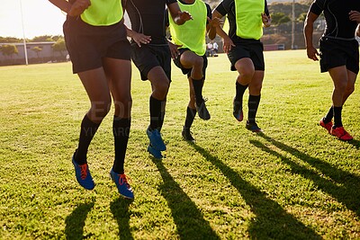 Buy stock photo Sports, men and legs with training for rugby, competition game and practice with warm up for match. Stadium, team and players with running for fitness, exercise and tournament with club by closeup