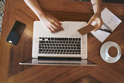 Buy stock photo Above, laptop and person with hands for credit card, digital banking and transaction for payment in cafe. Coffee store, customer or tech with debit for online shopping, typing or ecommerce by closeup