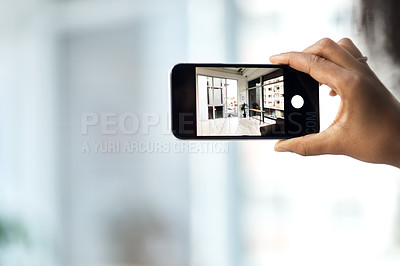 Buy stock photo Hands, person and phone screen with photography of house interior, living room design and property sale. Agent, mobile and picture with real estate, renovation process and home space of showroom post