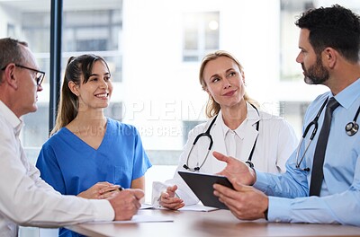 Buy stock photo Teamwork, tablet and doctors in meeting in hospital for medical results, consulting or online research. Healthcare, clinic and men and women on digital tech for wellness, telehealth or patient report