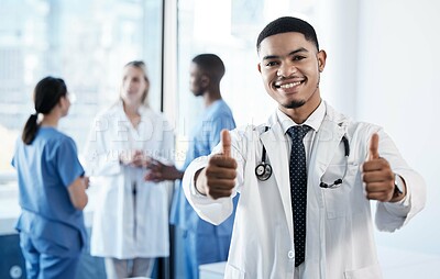 Buy stock photo Doctor, man and thumbs up in portrait at hospital for agreement, choice or good news for wellness. Medic, person and happy with emoji, like or sign for vote with healthcare services by team in clinic