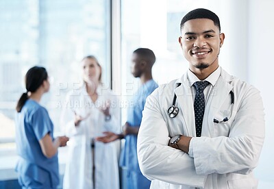 Buy stock photo Doctor, man and arms crossed with smile in portrait, hallway and pride for medical career in hospital. Person, medic and happy by team with confidence for services, healthcare or wellness at clinic