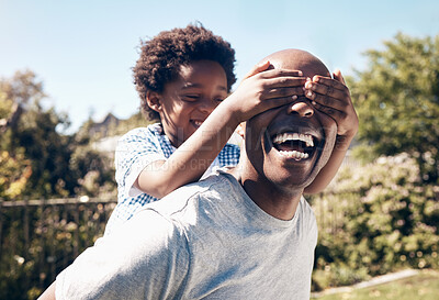 Buy stock photo Eyes closed, backyard and dad with child for playing, fun and bonding together on weekend. Family, happy and African father with son on grass for playful relationship, childhood and relax outdoors