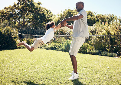 Buy stock photo Spin, backyard and dad with child for playing, fun and bonding together on summer weekend. Family, happy and African father with son on grass for playful relationship, childhood and relax outdoors