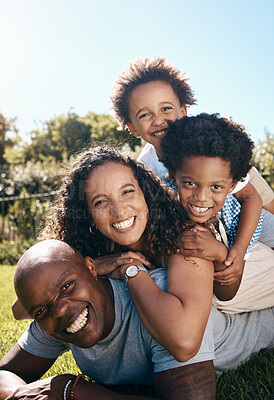 Buy stock photo Black family, portrait and happy on grass for travel, summer vacation and relax in pile. Parents, children and smile in nature park with love, relationship development or excited for holiday in Kenya