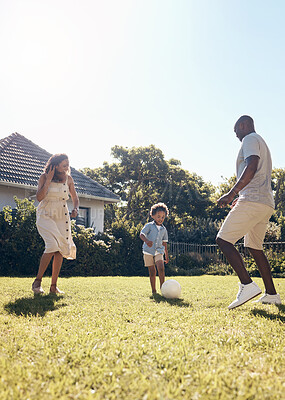 Buy stock photo Happy, football and parents playing with child in backyard for bonding, adventure or family time. Fun, outdoor and kid learning soccer with mom and dad in garden for sports development and exercise.