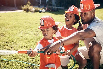 Buy stock photo Family, water and firefighter in home for fun, learning development or excited in Halloween costume. African man, firemen kids or hose pipe in backyard for activity, spray or summer games for bonding