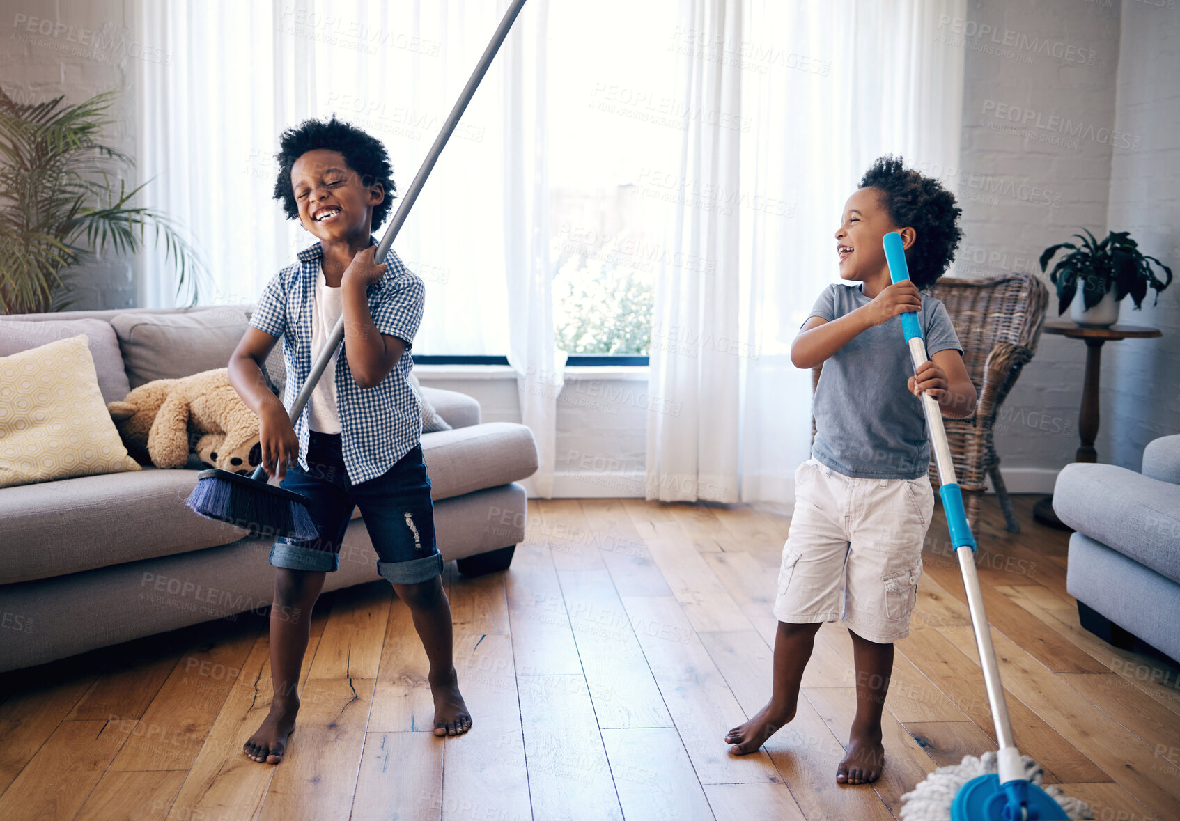 Buy stock photo Home, mop and broom with children for cleaning, singing and fun activity for entertainment in lounge. Kids, siblings and boys with household tools for playful, imaginative and bonding with chores