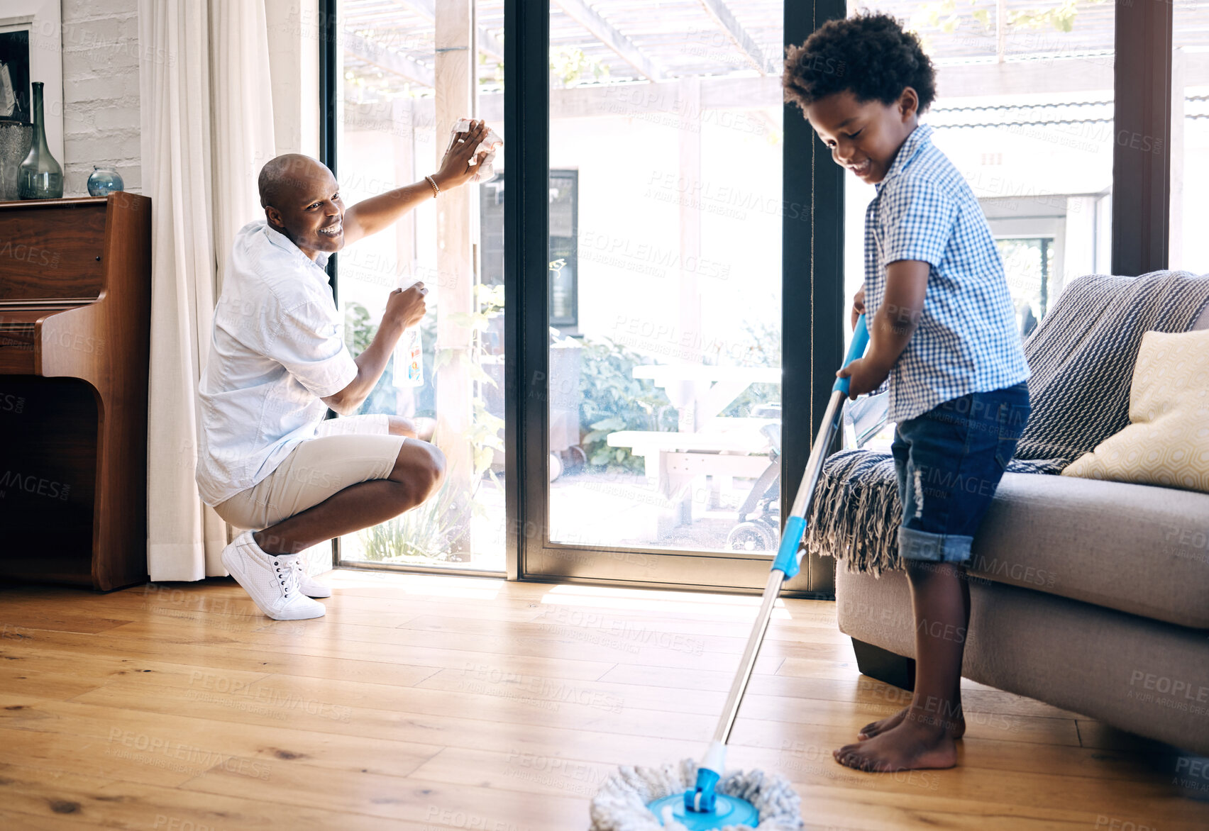 Buy stock photo Cleaning, dad and son in home, smile and teaching of responsibility, growth and development of child. House, happy and black family with chores, man and boy in living room for hygiene and bonding