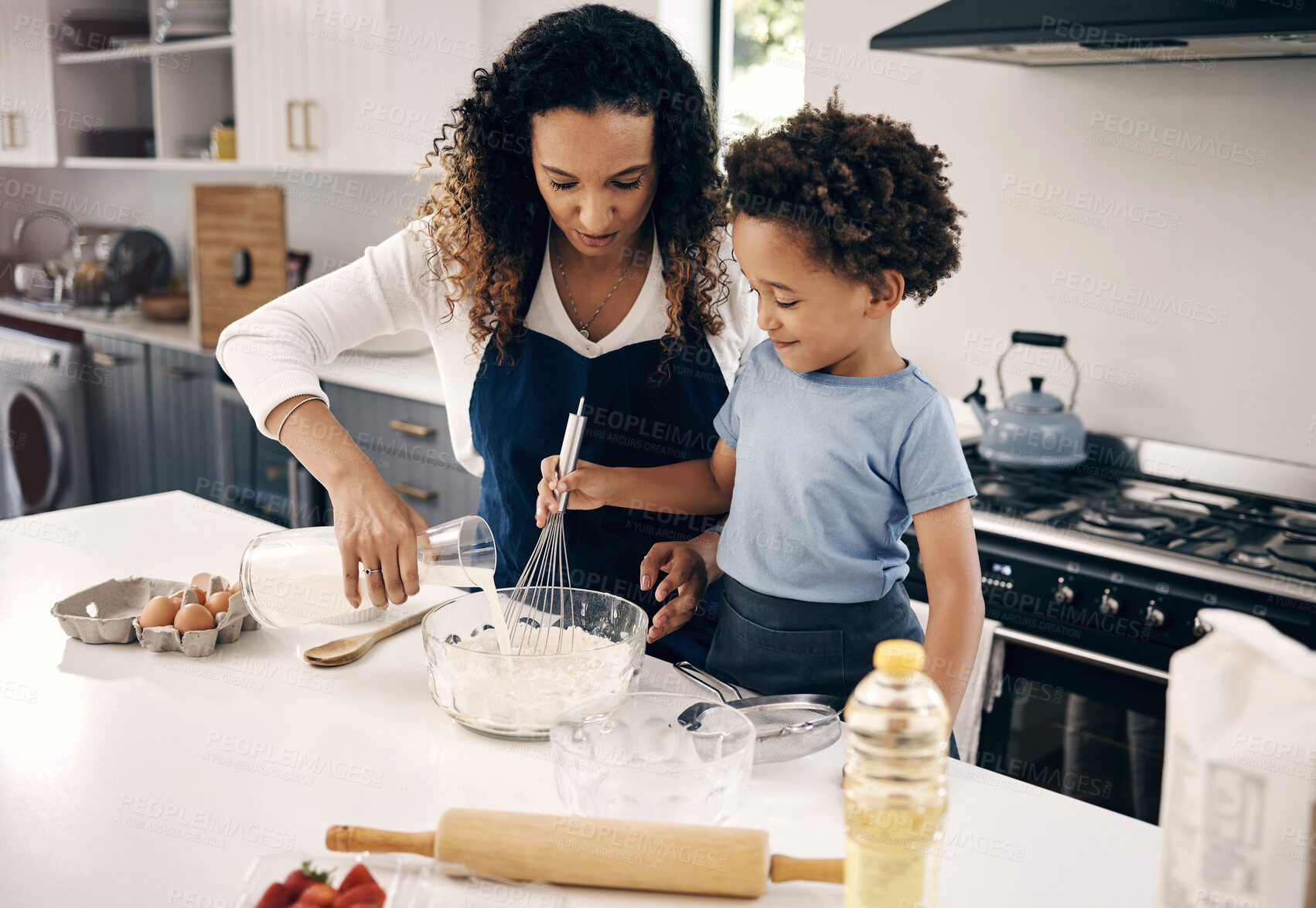 Buy stock photo Kitchen, mother and child with milk for baking, teaching and kid development with breakfast at home. Family, mom and boy with support for learning, mixing flour and ingredients with bonding in house
