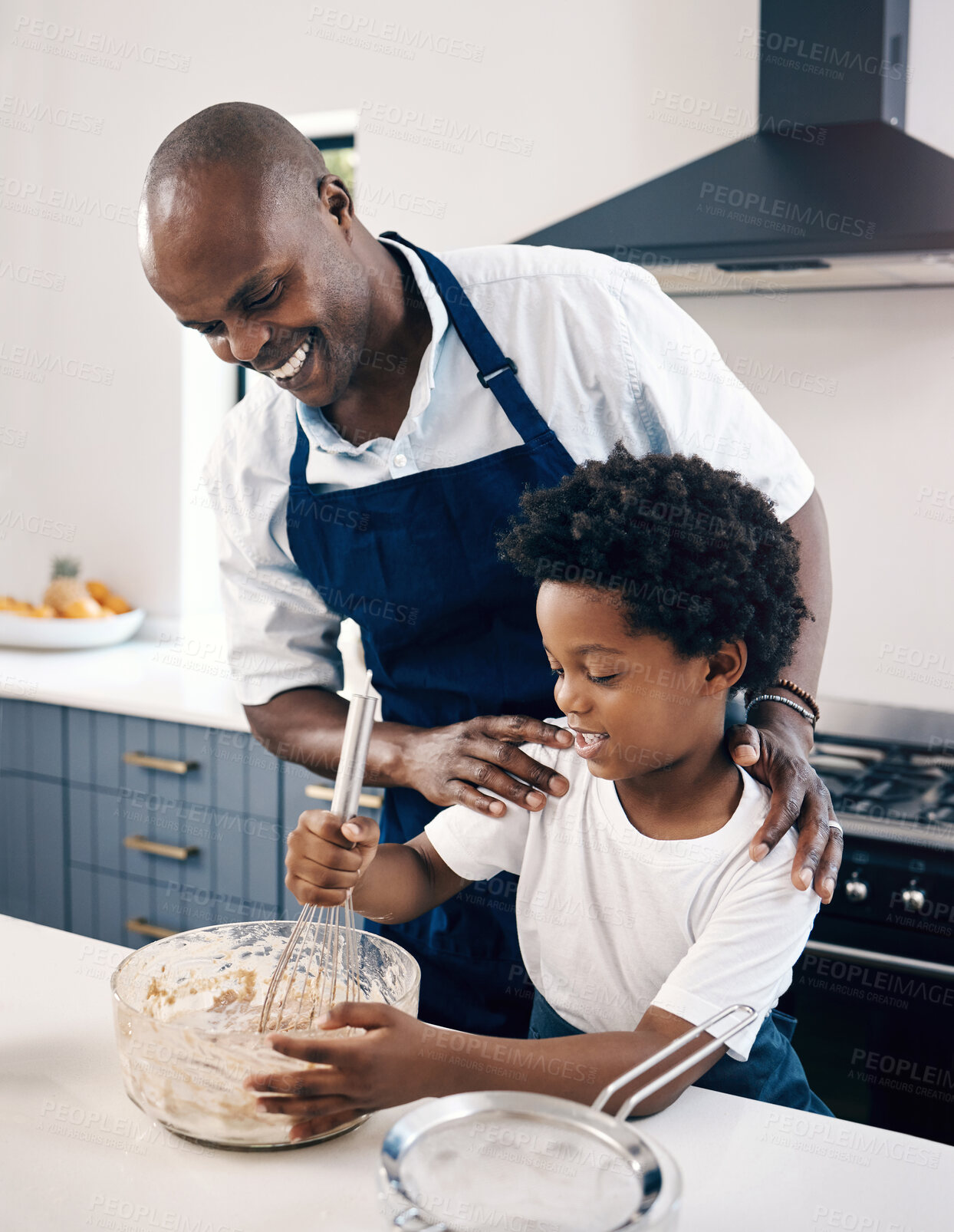 Buy stock photo Learning, baking and father with child in kitchen for mixing ingredients for cake, muffins or cookies. Happy, bonding and African dad teaching boy kid cooking skills for development in family home.