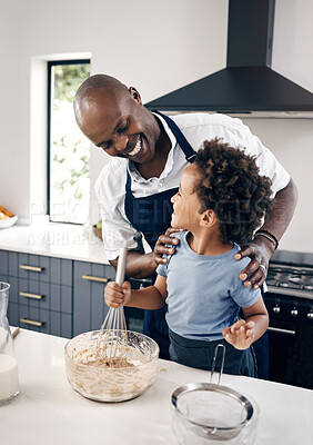 Buy stock photo Kitchen, father and child with smile for baking, teaching and kid development with breakfast at home. Family, dad and boy with support for learning, mixing flour and ingredients with bonding in house