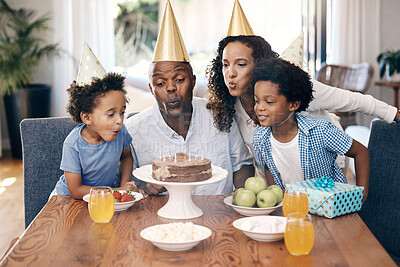 Buy stock photo Cake, candles and family at birthday in home for party, event or gathering together for bonding. Love, connection and children with parents for celebration with hats, gifts and dessert for tradition.