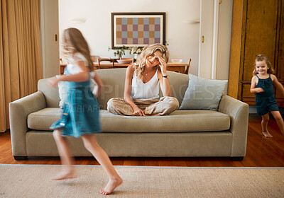 Buy stock photo ADHD, motion blur and stress of mother with children running in living room of home for hyperactivity. Anxiety, autism and energy with unhappy woman parent on sofa in apartment for break or rest