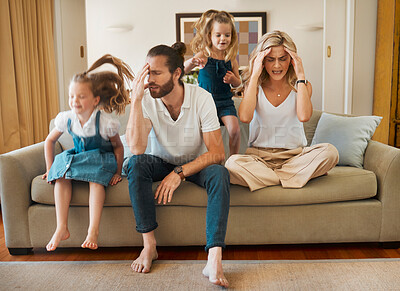 Buy stock photo ADHD, motion blur and stress of parents with kids playing in living room of home for hyperactivity. Anxiety, autism and energy with unhappy mother and father on sofa in apartment for break or rest