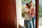 Little girl kissing her mother. Young mother hugging her daughter. Loving mother hugging daughter before school outside. Little girl going to school. Happy woman embracing daughter