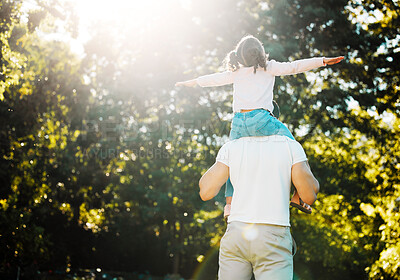 Buy stock photo Back, child or piggyback in park with dad, love and trust in garden for playing together on holiday. Single parent, walking or father in nature with care, girl or daughter flying on outdoor vacation