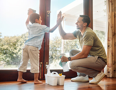 Buy stock photo Cleaning, door and high five of father with son in living room of home together for weekend chores. Motivation, success or teamwork of man parent and boy child in apartment with rag and spray bottle