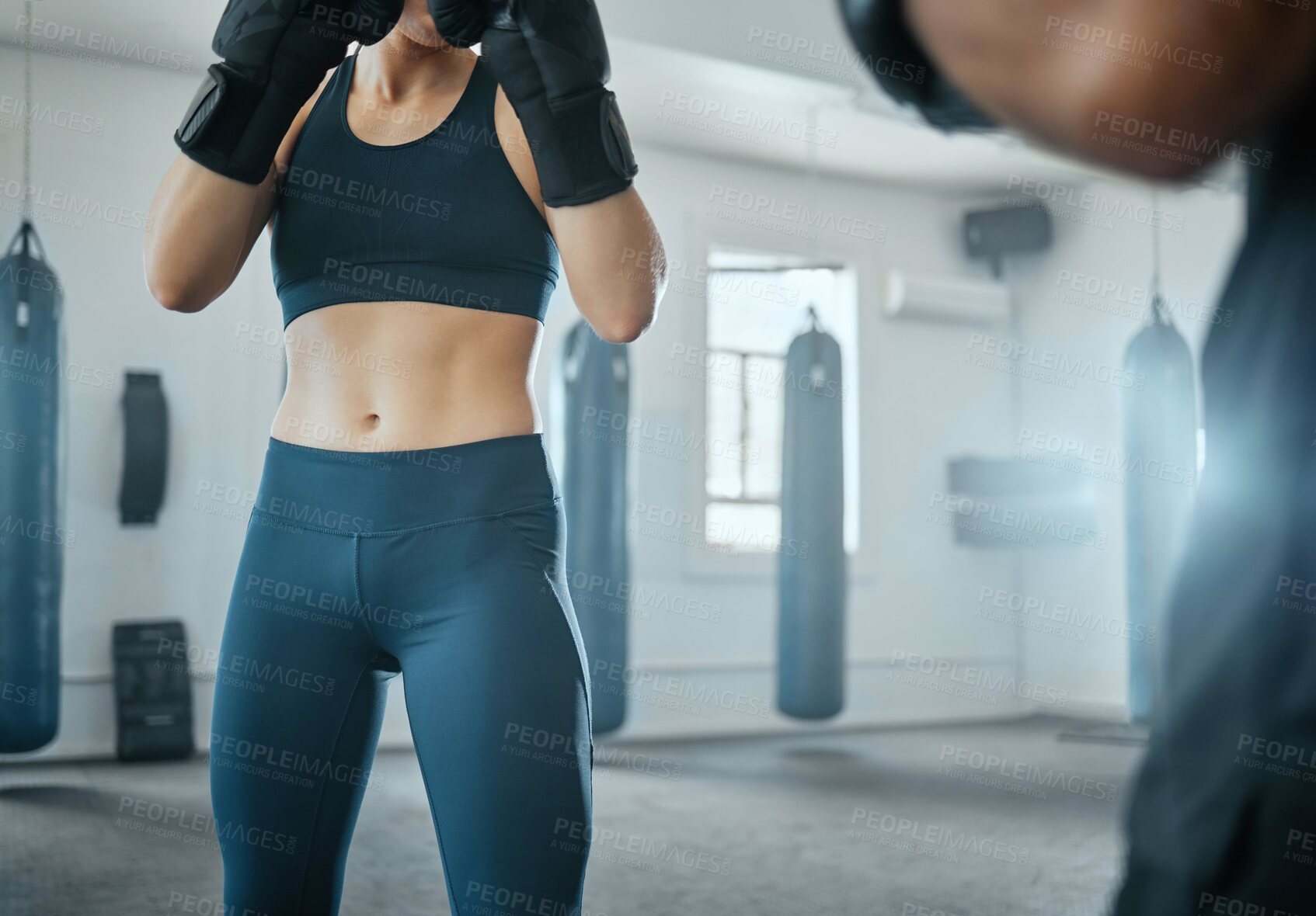 Buy stock photo Female fitness boxing with trainer, learning self defense with coach at gym and training for wellness at a sports center with an instructor. Man teaching an athletic woman to fight and do cardio