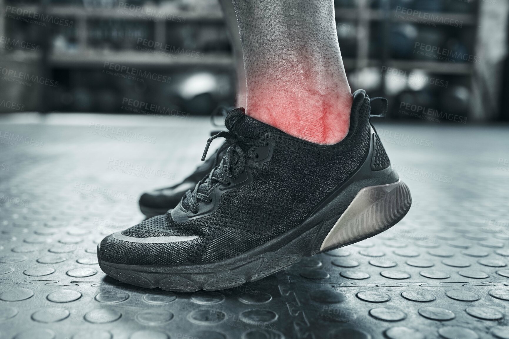 Buy stock photo Ankle pain, injury and medical with person on floor of gym for accident, fail or mistake in black and white. Anatomy, emergency and fitness with red highlight on joint of hurt athlete in grayscale