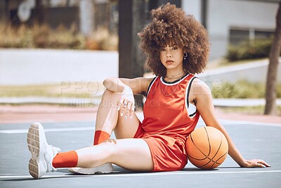 Buy stock photo Confident female basketball coach with ball outside. Women's fitness motivation, workout, sports training and exercise wellness. Strong, powerful pro athlete posing for portrait on netball court.