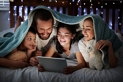 Buy stock photo Happy, parents and children with tablet at night of storytelling, watching movies or bonding together. Smile, family and kids on digital for streaming cartoon, online ebook and entertainment at house