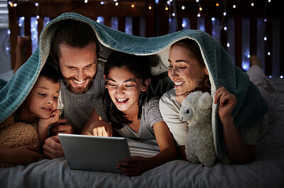 Buy stock photo Smile, parents and children with tablet at night of storytelling, watching movies or bonding together. Happy, family and kids on digital for streaming cartoon, online ebook and entertainment at house