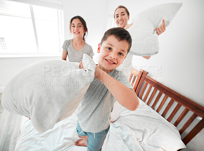 Buy stock photo Happy boy, pillow fight or portrait of mom, girl on bed in morning together for fun bonding in home. Smile, children or excited kids playing games as family with cushion, mother or parent in house