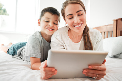 Buy stock photo Tablet, bedroom and happy mother with child for learning, education or play game together in home. Technology, boy and mom relax in bed, streaming movie and watch cartoon on internet app with parent